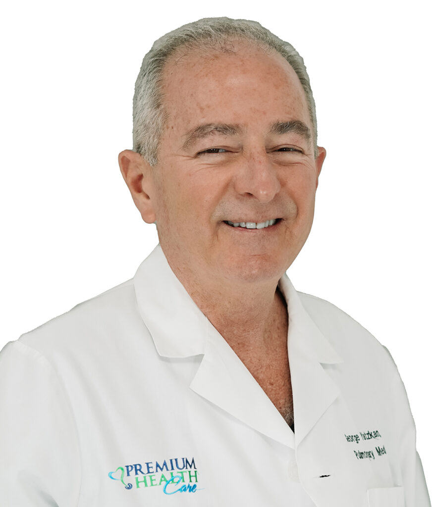 Picture of Doctor George Yatzkan smiling at the camera in a white coat.