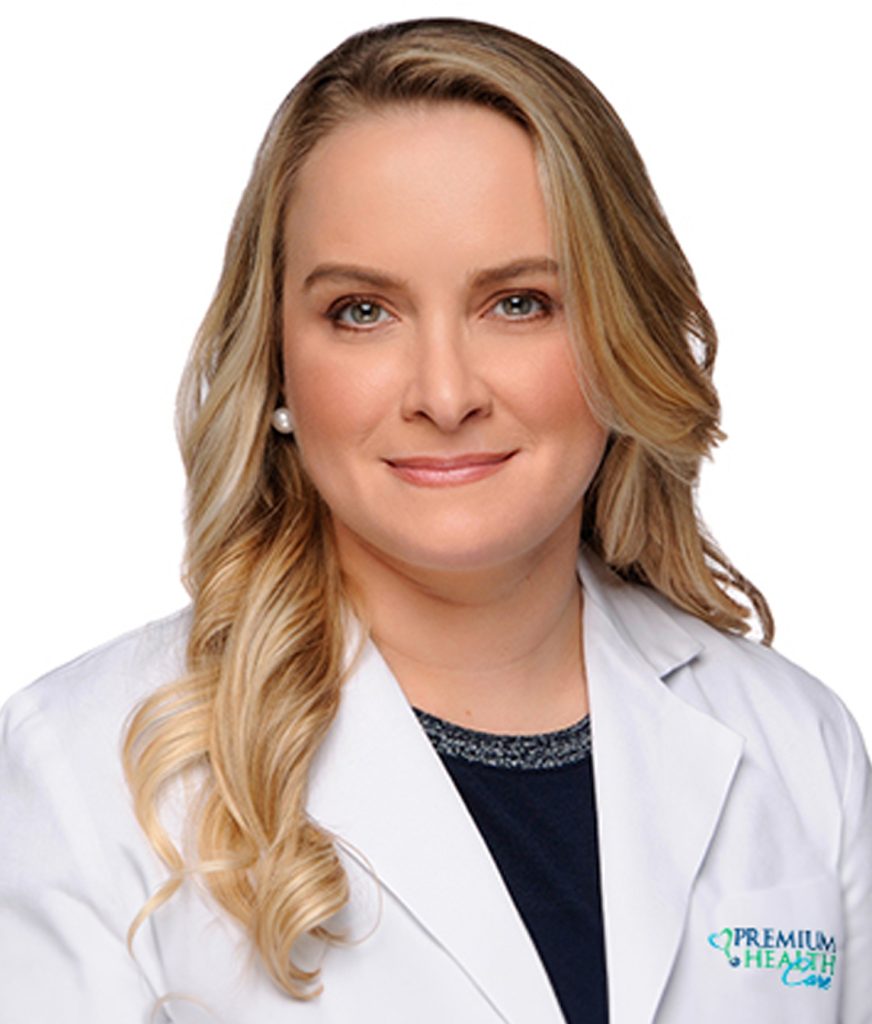 Doctor Elie Haddad in a white coat smiling at the camera